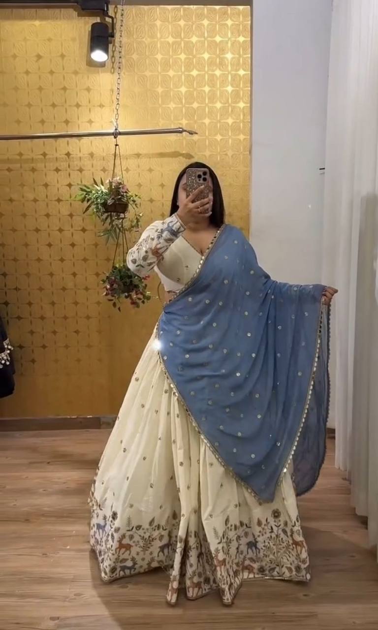 Ivory Elegance Lehenga with Pastel Blue Dupatta And Deer Motif Embroidery