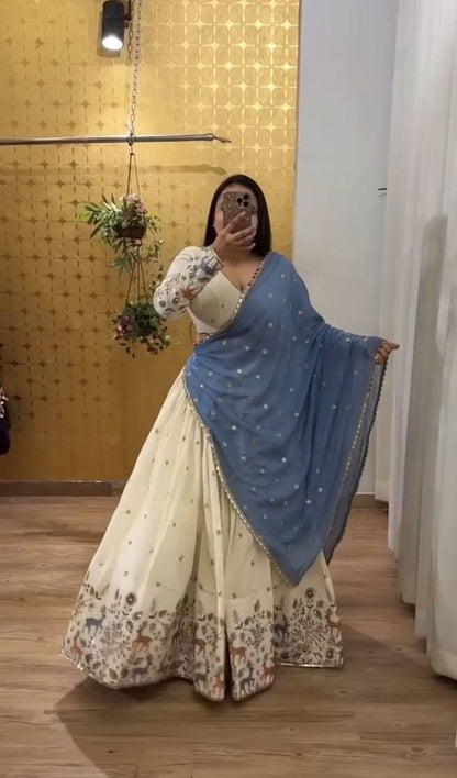 Ivory Elegance Lehenga with Pastel Blue Dupatta And Deer Motif Embroidery