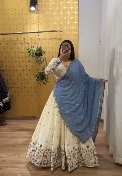 Ivory Elegance Lehenga with Pastel Blue Dupatta And Deer Motif Embroidery