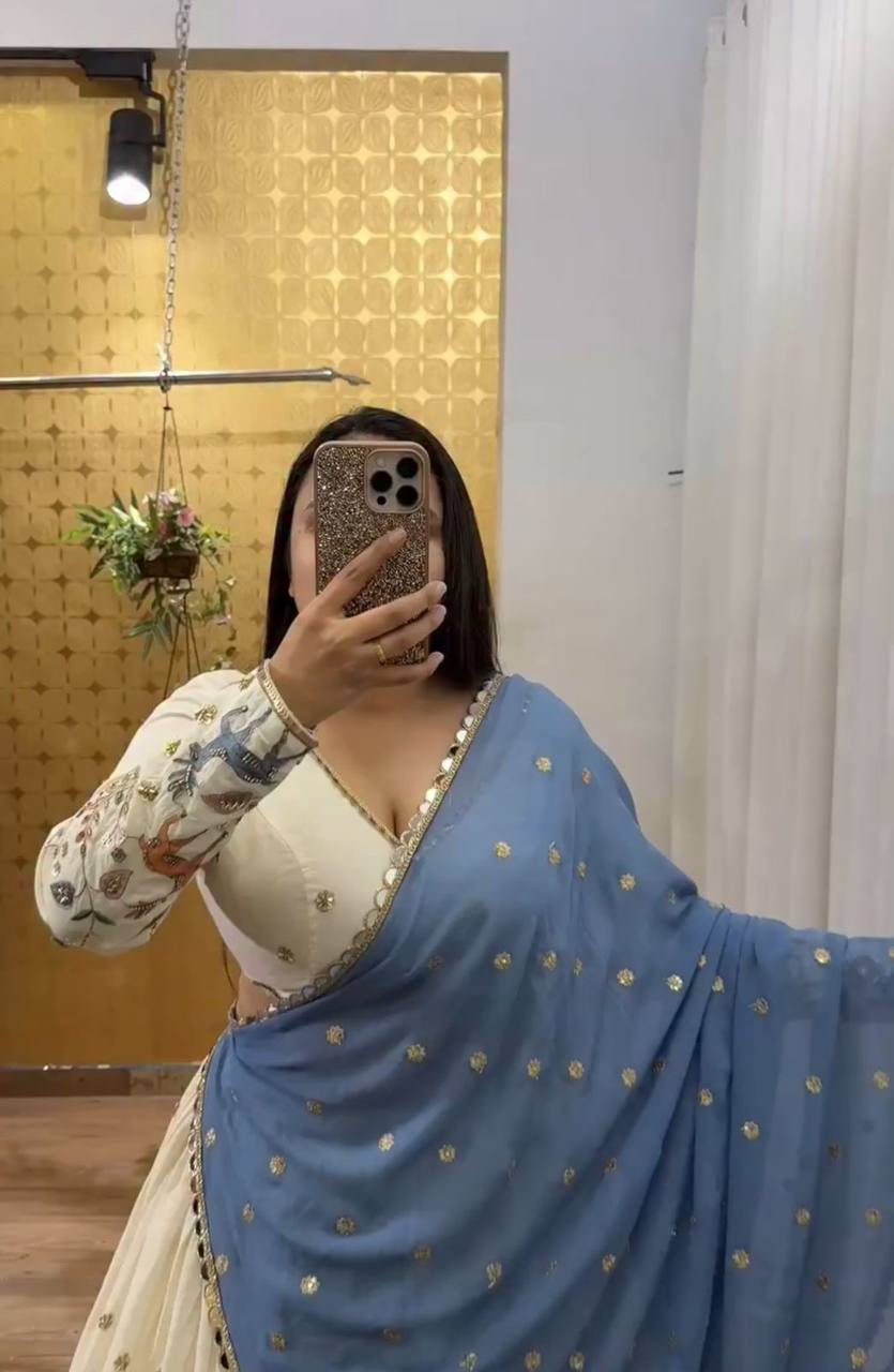 Ivory Elegance Lehenga with Pastel Blue Dupatta And Deer Motif Embroidery